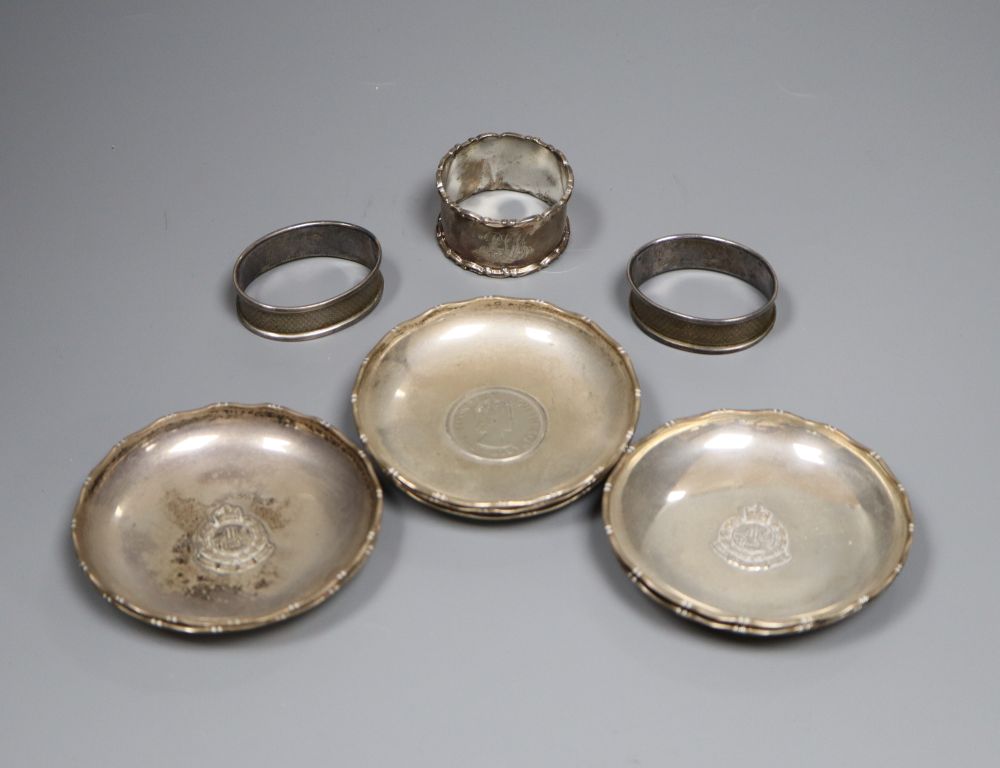 Six Hong Kong sterling dishes, with inset coin and three napkin rings.